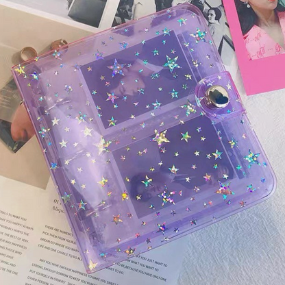Purple planner with star designs on a surface with photos and text.