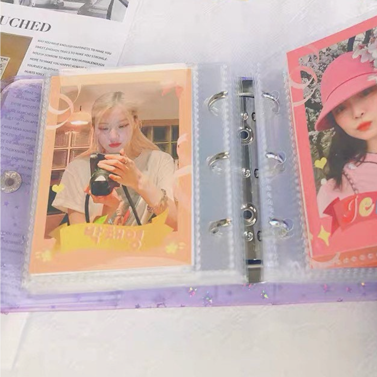 Collection of photo cards in a ring binder with images of people and text.