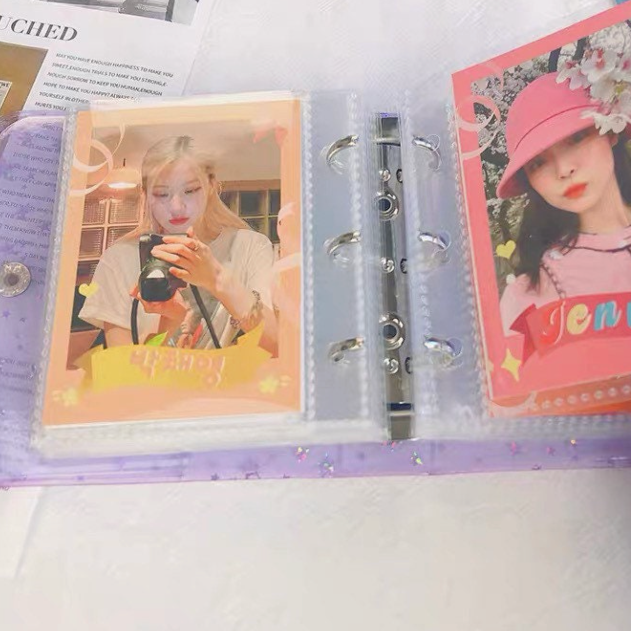 Collection of photo cards in a ring binder with images of people and text.