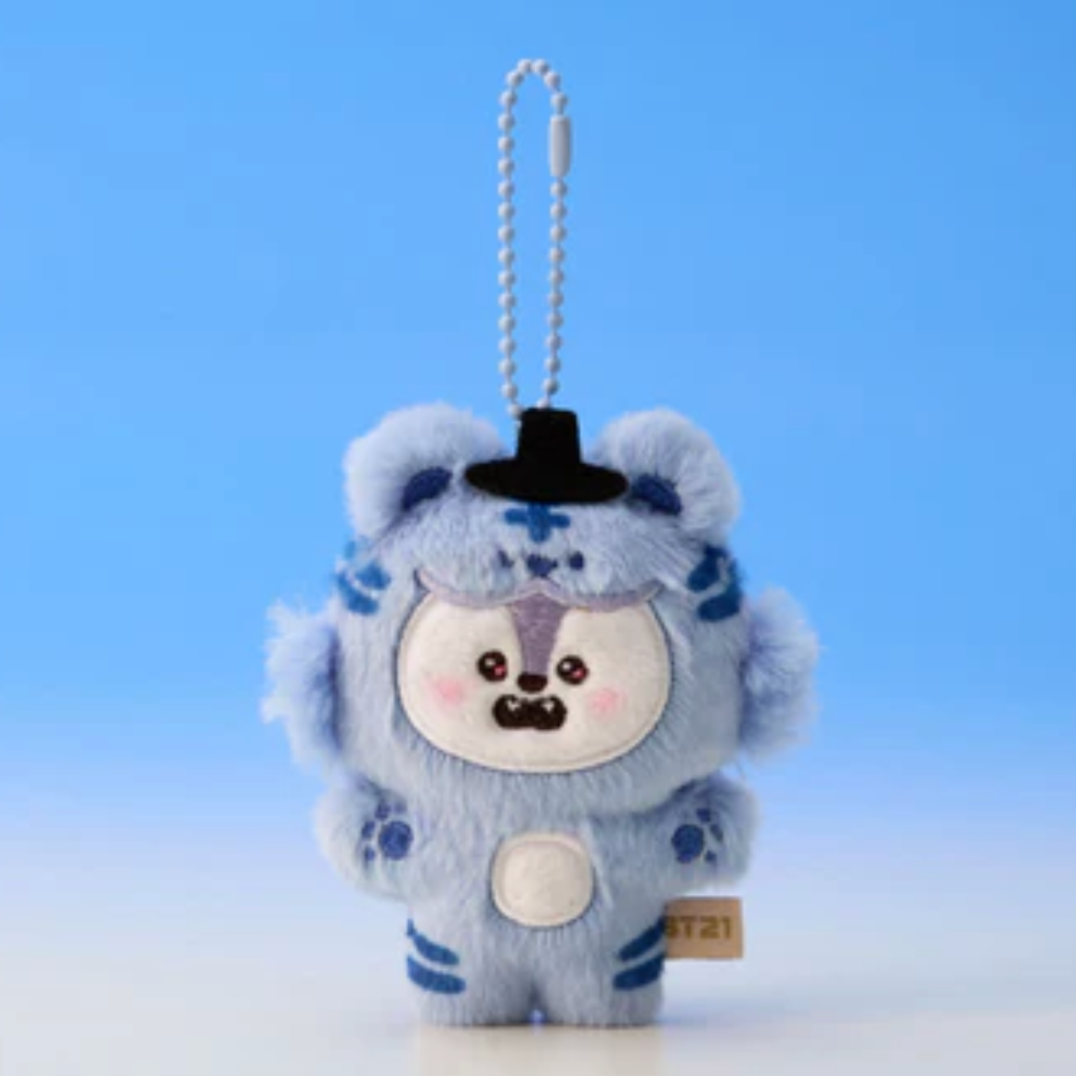 Plush keychain with a blue and white design on a light blue background