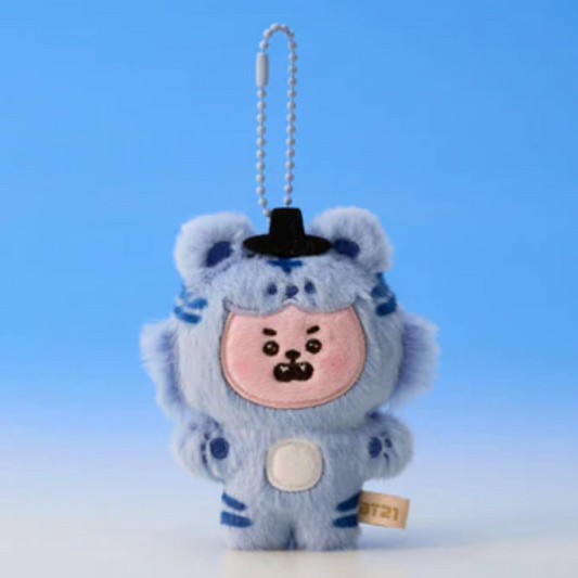 Plush keychain of a character in a blue outfit with a black hat on a light blue background