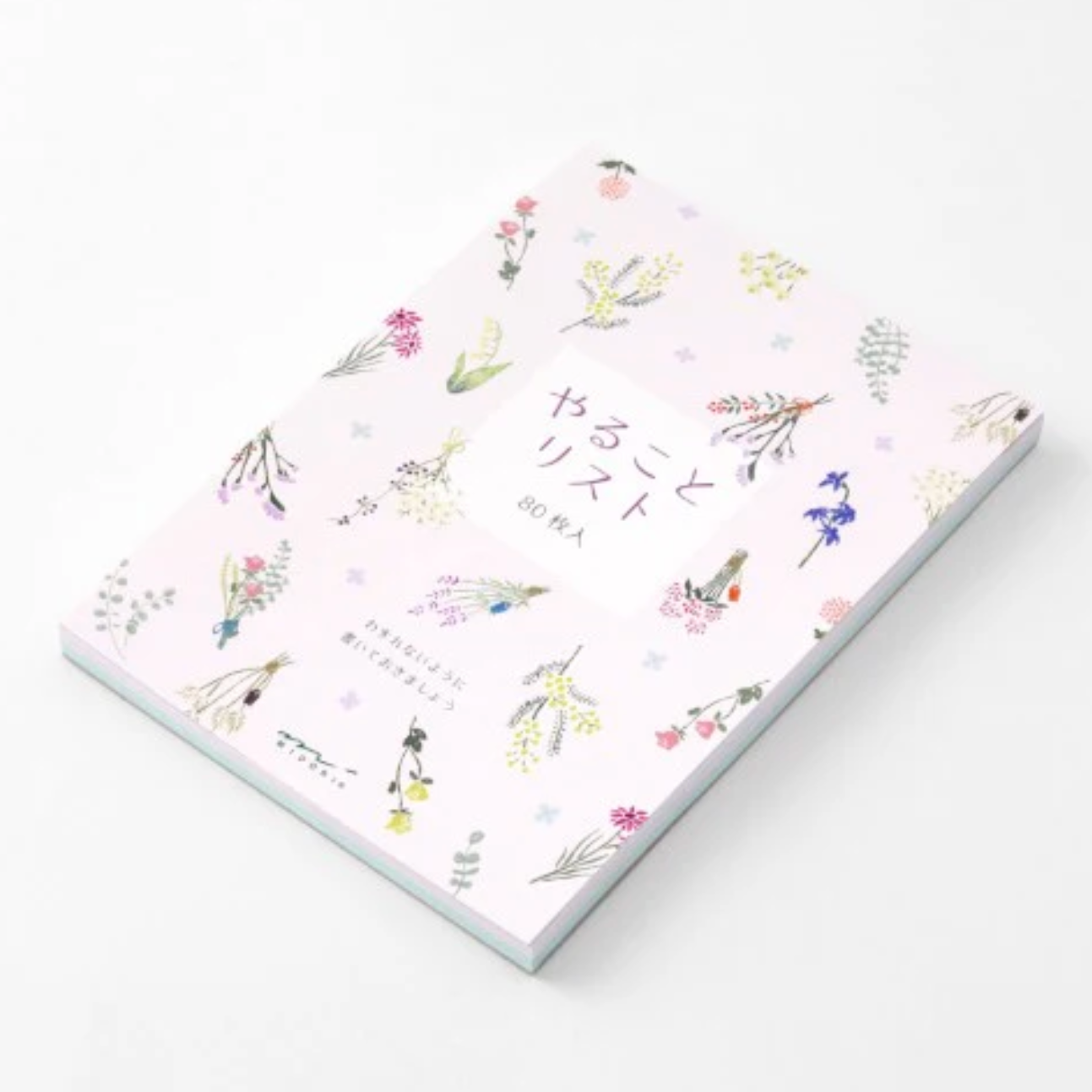 Notebook with floral design on a white background