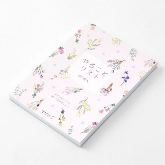 Notebook with floral design on a white background