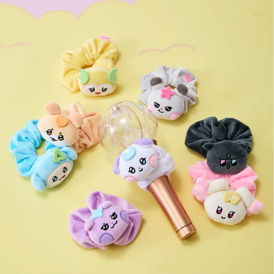 Set of colorful hair accessories with cartoon faces on a yellow background