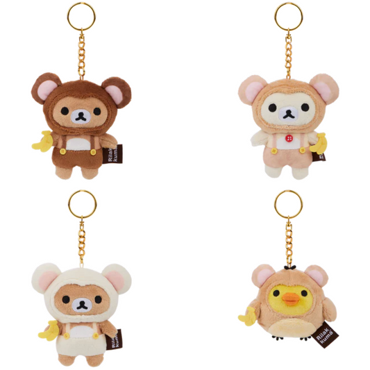Four plush keychains shaped like cartoon characters on a white background