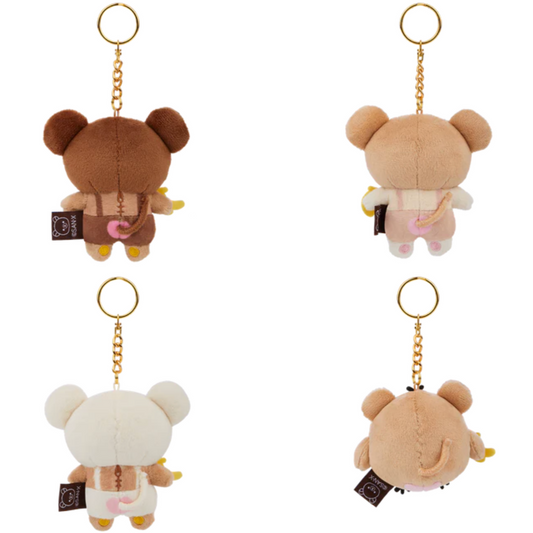 Four bear-shaped keychains in different poses on a white background