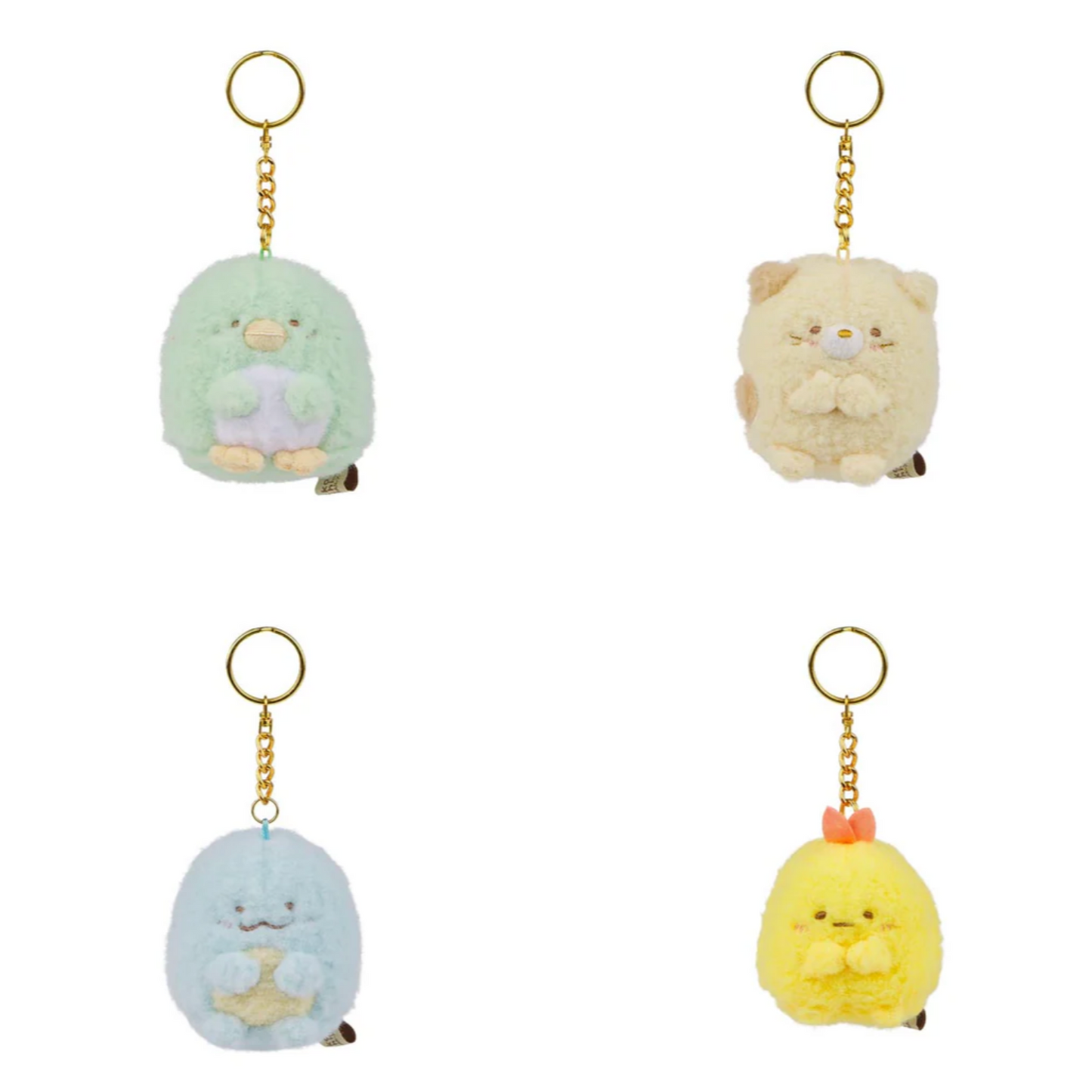 Four small plush keychains on a white background