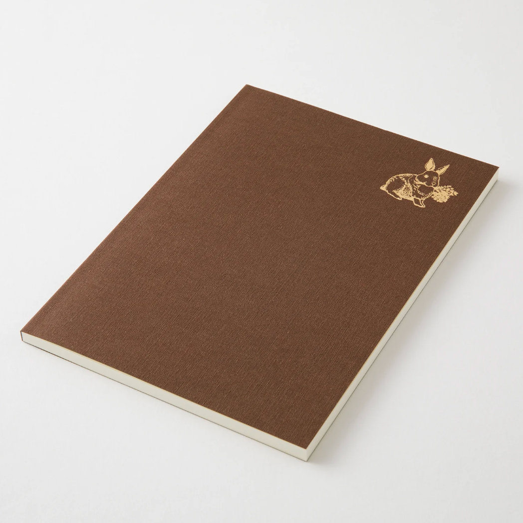 Brown notebook with a gold emblem on a white background