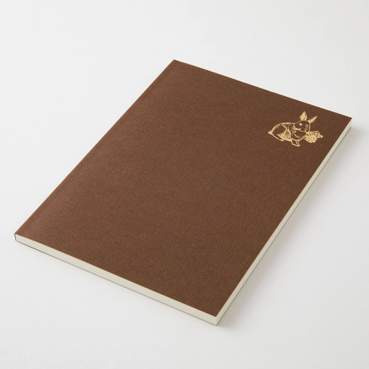 Brown notebook with a gold emblem on a white background