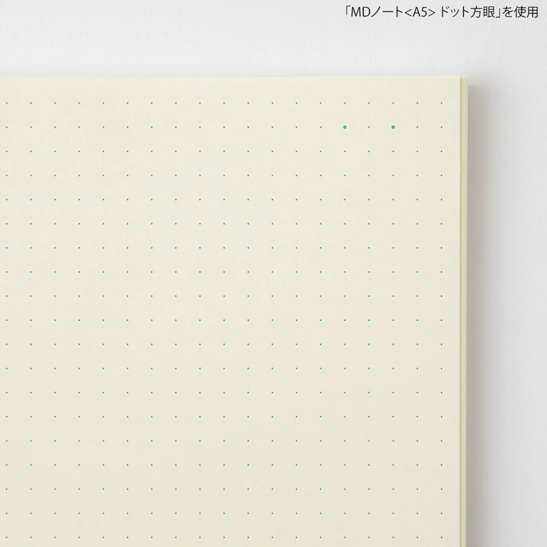 Notebook with dot grid on a white background