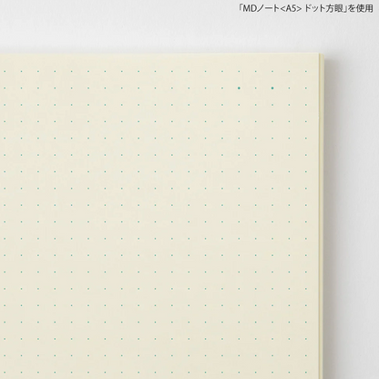 Notebook with dot grid on a white background