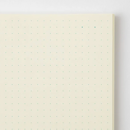 Notebook with dot grid on a white background
