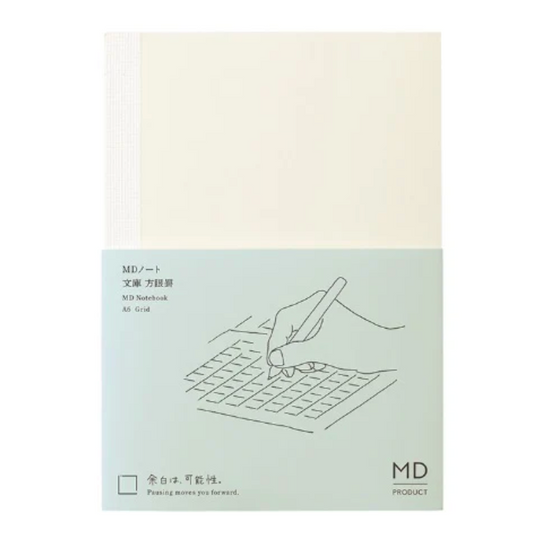 Notebook cover with a hand holding a pen over a grid design on a light green background.