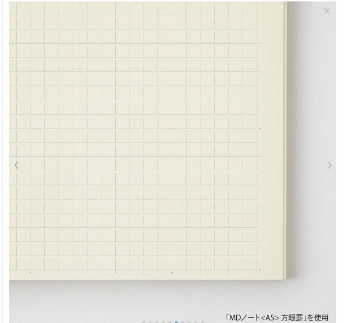 Grid notebook page on a light gray background