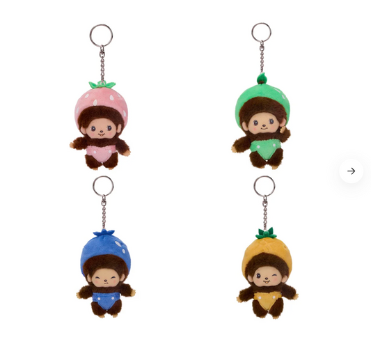 Four small plush keychains with colorful hats on a white background