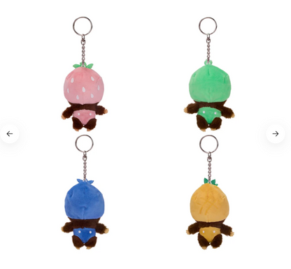 Four colorful plush keychains shaped like cartoon characters on a white background