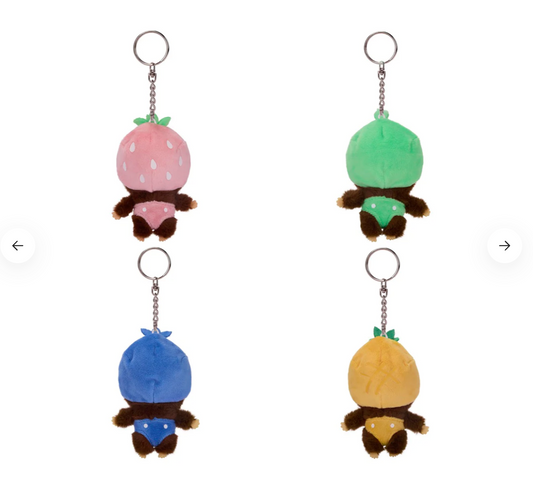 Four colorful plush keychains shaped like cartoon characters on a white background