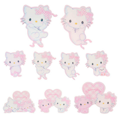 Set of Hello Kitty plush toys with various poses on a white background