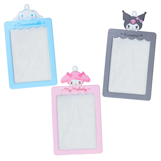 Three small rectangular photo holders with Sanrio character tops on a white background