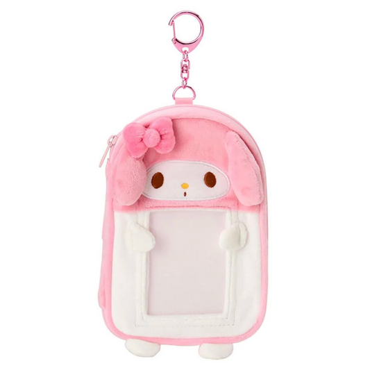 Pink plush keychain with a character design on a white background