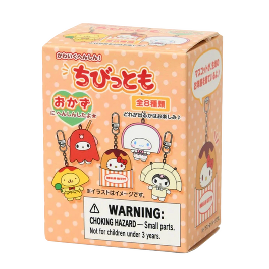 Box of small Sanrio character keychains with a warning label on a white background