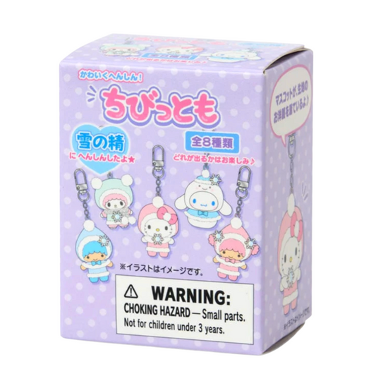 Box of small character figurines keychain with a warning label on a white background