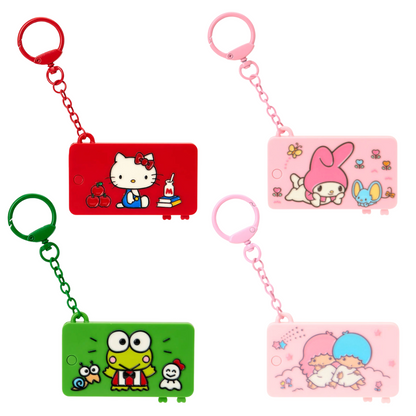Four cartoon character keychains on a white background