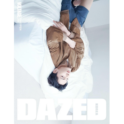 Person lying on a bed with a magazine cover featuring the brand 'Dazed' in the background.