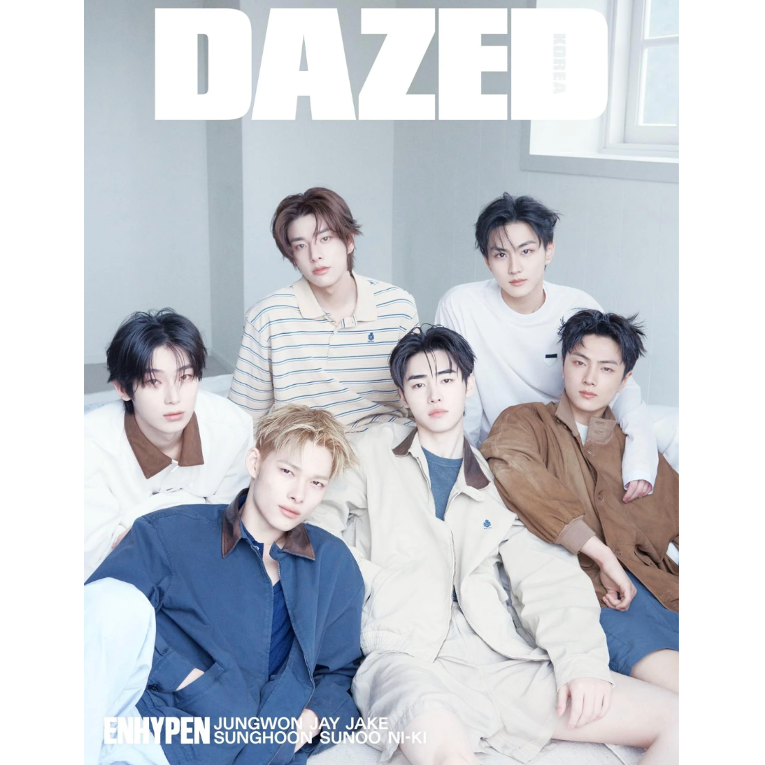 Group of people sitting together with 'DAZED' magazine cover in the background