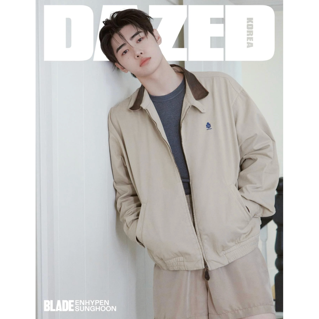Person wearing a beige jacket on a magazine cover with 'Dazed' branding