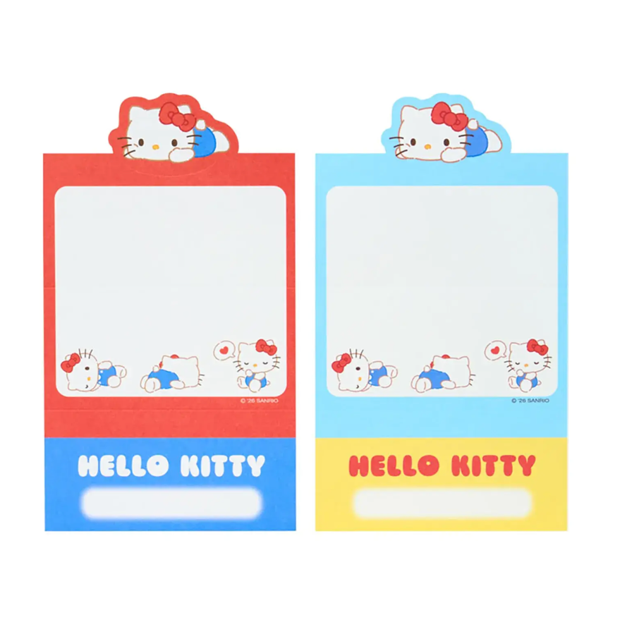 Two 'Hello Kitty' themed notepads, one red and blue, the other yellow and blue, on a white background.