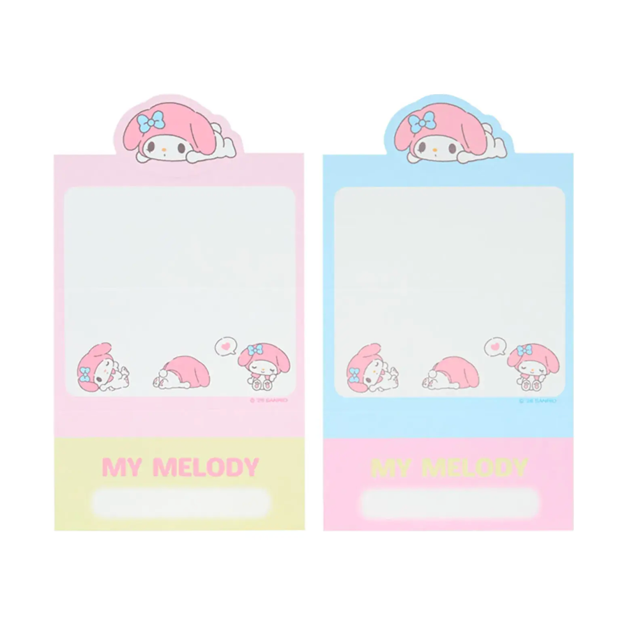 Two small notepads with Sanrio cartoon character design on a white background