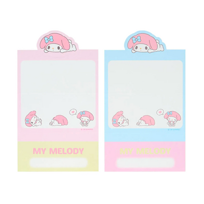 Two small notepads with Sanrio cartoon character design on a white background