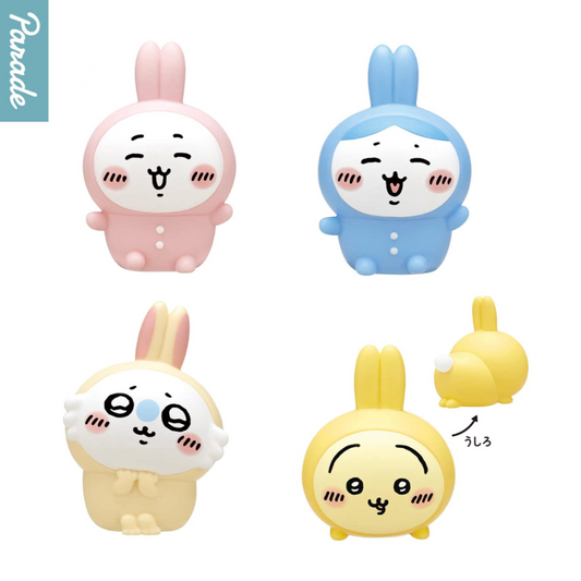 Four colorful cartoon character figurines in different colors on a white background.