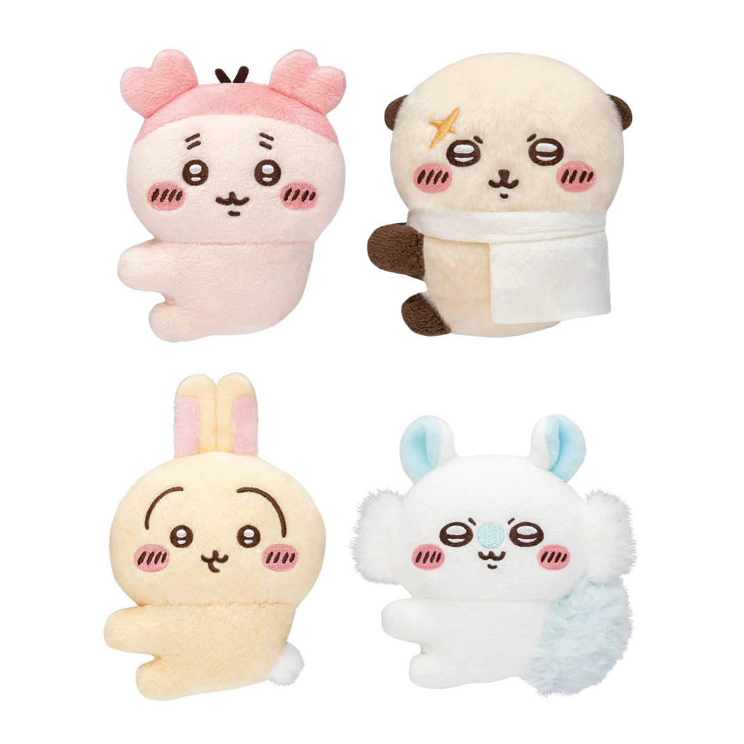 Four cute plush toys with cartoon faces on a white background