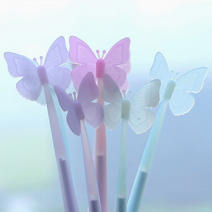 Butterfly-shaped pens on a soft blue background