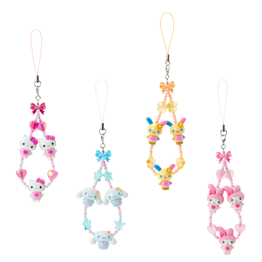 Set of four colorful phone charms with cartoon characters on a white background