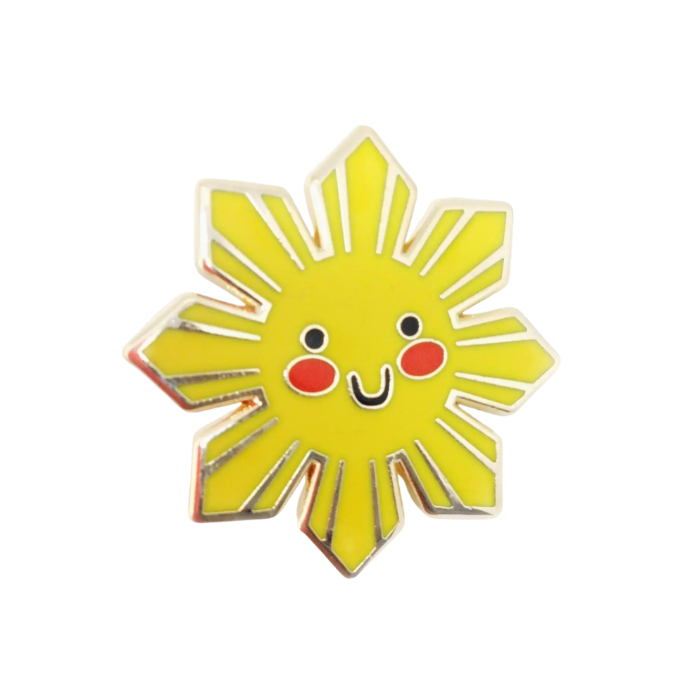 Sun-shaped pin with a smiling face on a white background
