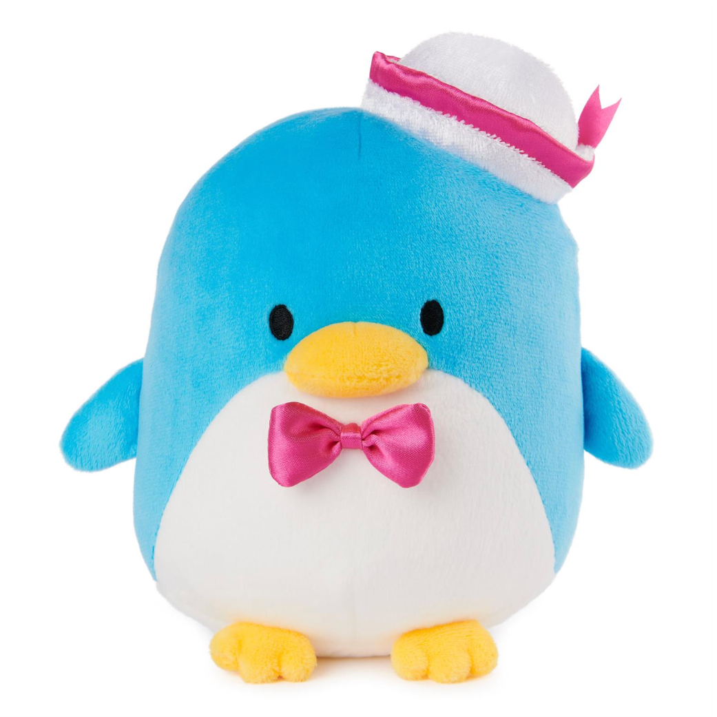 A blue and white plush penguin toy wearing a pink and white hat, with a pink bow tie and yellow beak and feet, shown against a plain white background.