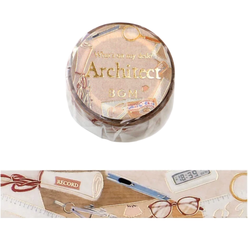 A roll of decorative washi tape with an 'Architect' theme, featuring a clear plastic lid with gold foil lettering and a printed design of desk accessories. A horizontal strip of the unrolled tape is shown below, displaying beige, pink, and brown tones with illustrations of a pencil, glasses, a clock, and a notebook.