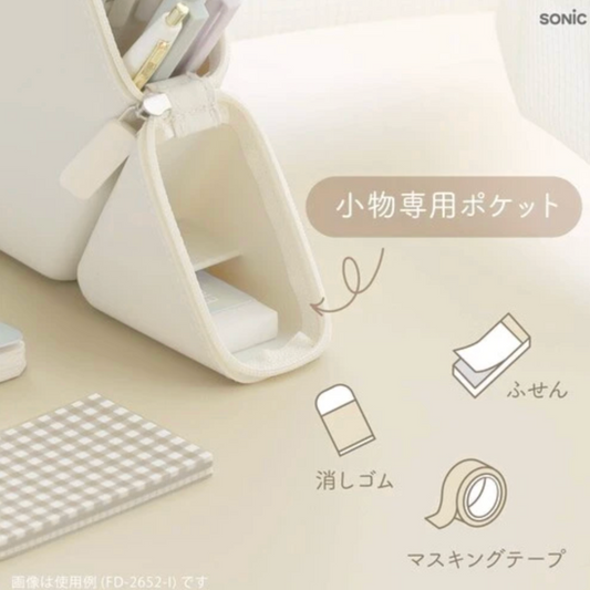Small white container with compartments on a beige background, featuring the brand 'SONIC'.
