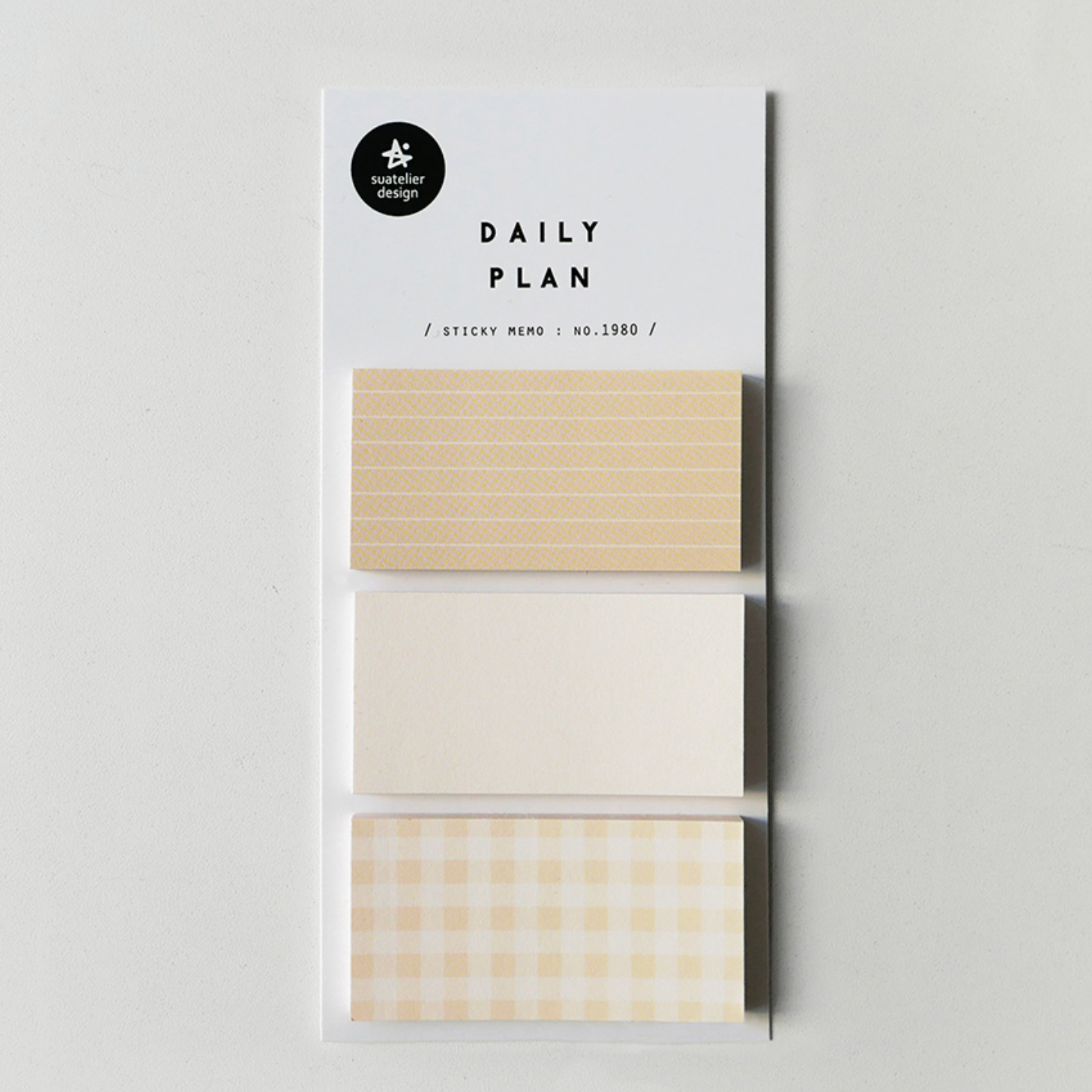 A package of three washi tape rolls labeled 'DAILY PLAN' by the brand 'paper paradise', featuring beige, white, and cream gingham patterns on a light gray background.