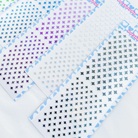 Five sheets of small twinkle stickers arranged diagonally on a white background. The sheets feature different color gradients and patterns, including green, blue, purple, pink, and silver-gray, with the brand name 'bopple' visible in the top right corner of each sheet.
