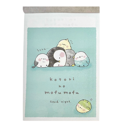 Memo pad featuring a light blue-green cover illustration of five Sumo-like animals resting together, with the text 'kotori no mofu mofu' and 'Good night.'.