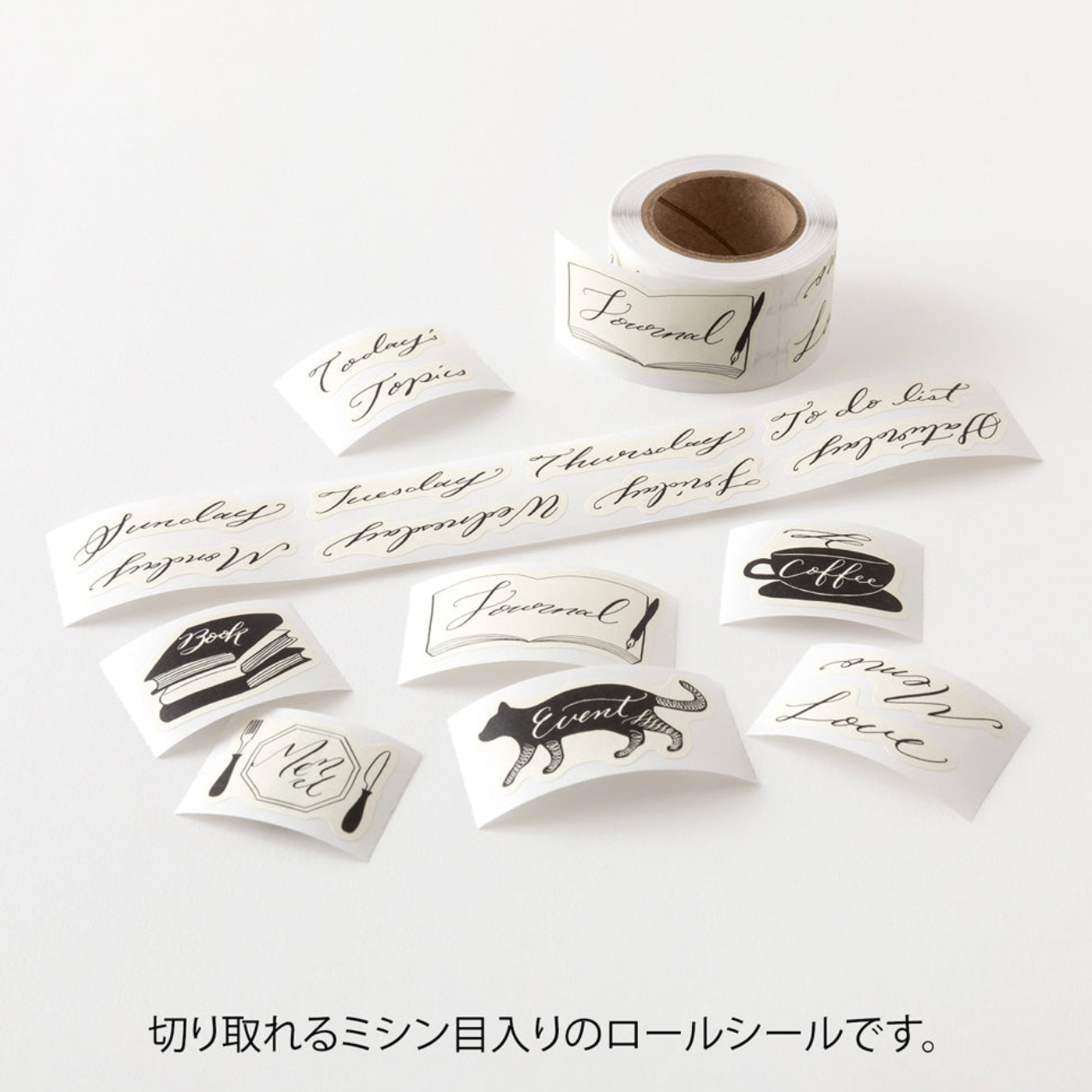 A set of white adhesive journaling and labeling stickers with elegant black calligraphy and illustrations, shown alongside a roll of the same sticker sheet on a clean white background with Japanese text at the bottom.