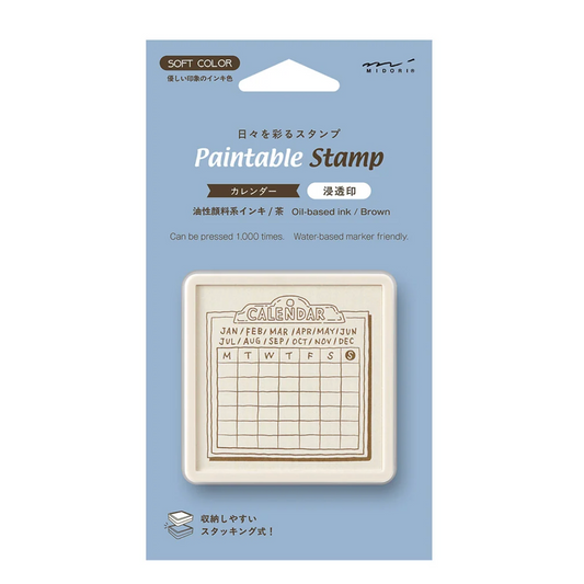 Paintable Stamp Calendar ink stamp in a light blue retail package with Japanese text and a small preview of the beige stamp face.