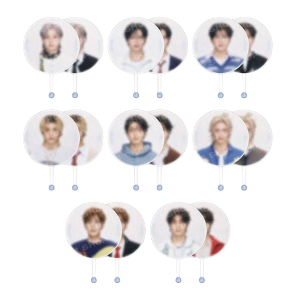 Twelve round white handheld mirrors with short handles, each reflecting a different young man's portrait, arranged in rows on a plain white background.