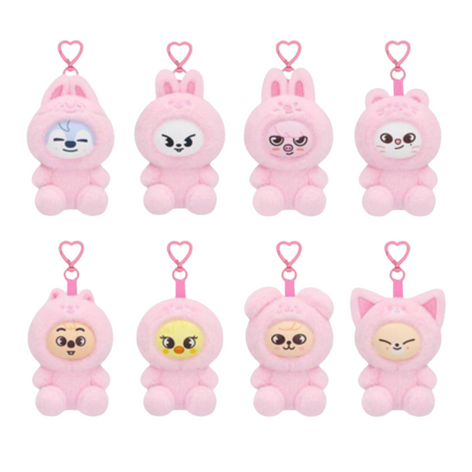Eight pink plush character keychain charms arranged in two rows on a white background, each with a small heart-shaped clip and a different cute face design.