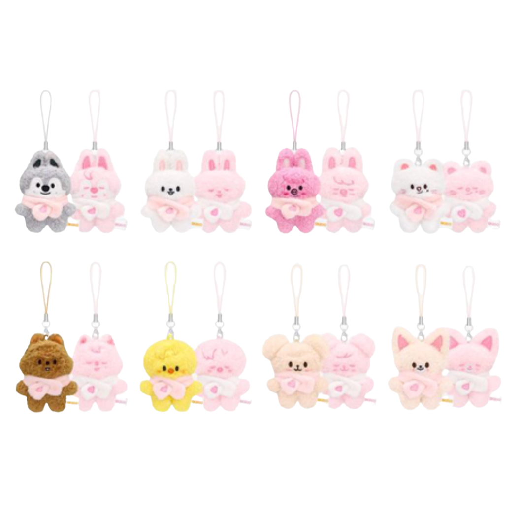 Twelve small plush character charms with hanging loops, arranged in two rows on a plain white background. The set includes gray, white, pink, brown, yellow, and peach animal and bunny figures.