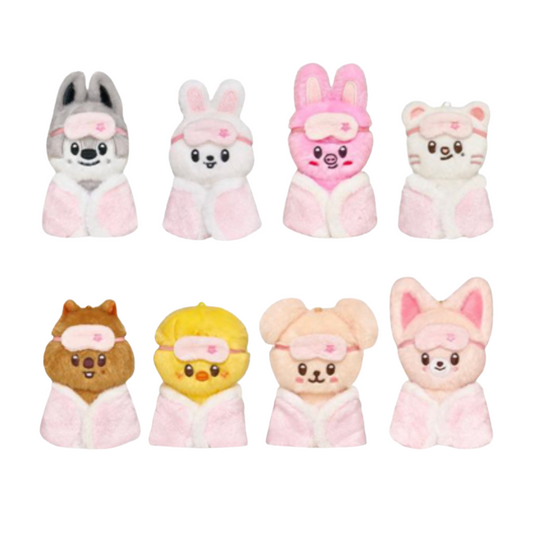 Eight small plush animal bath towels arranged in two rows on a plain white background. The characters include gray, white, pink, cream, brown, yellow, peach, and pink rabbits, bears, and a fox, each wearing a pink towel and headband.